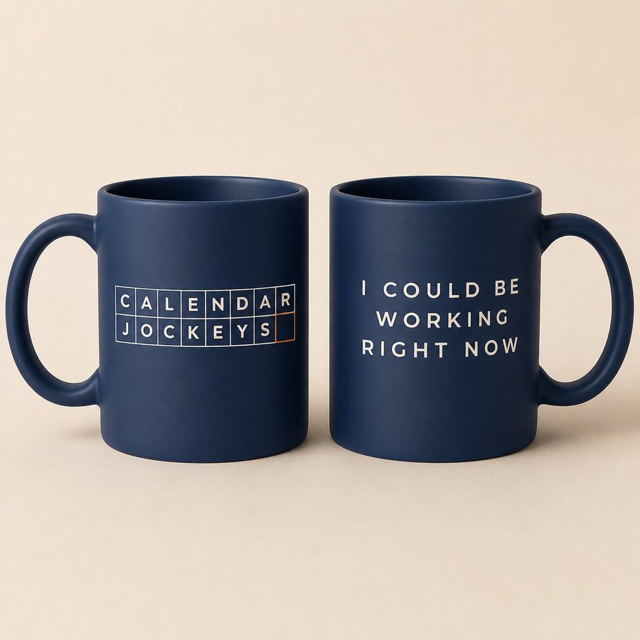 Navy mug with the Calendar Jockeys end-card wordmark on one side and I Could Be Working Right Now on the other